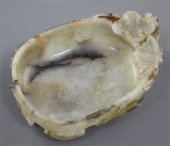 A Chinese white and grey jade brushwasher, 16th / 17th century, length 11.3cm
